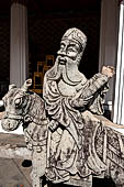 Bangkok Wat Arun - the gallery is lined all around with beautiful statues of chinese figures. 